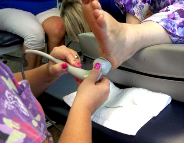 Ultrasound being used on foot, plantar fasciatus